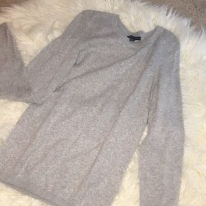 A gray Tommy Hilfiger sweater.